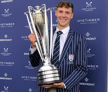 GoPodium co-founder Shay Bradley holding a championship trophy